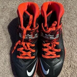 Nike Black and Red High-Top Sneakers for Performance